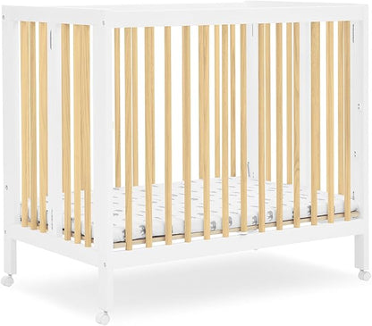 Delta Children Mia Portable Folding Mini Crib with 1.5-Inch Mattress - Greenguard Gold Certified, Bianca White/Natural - LeafyLoom