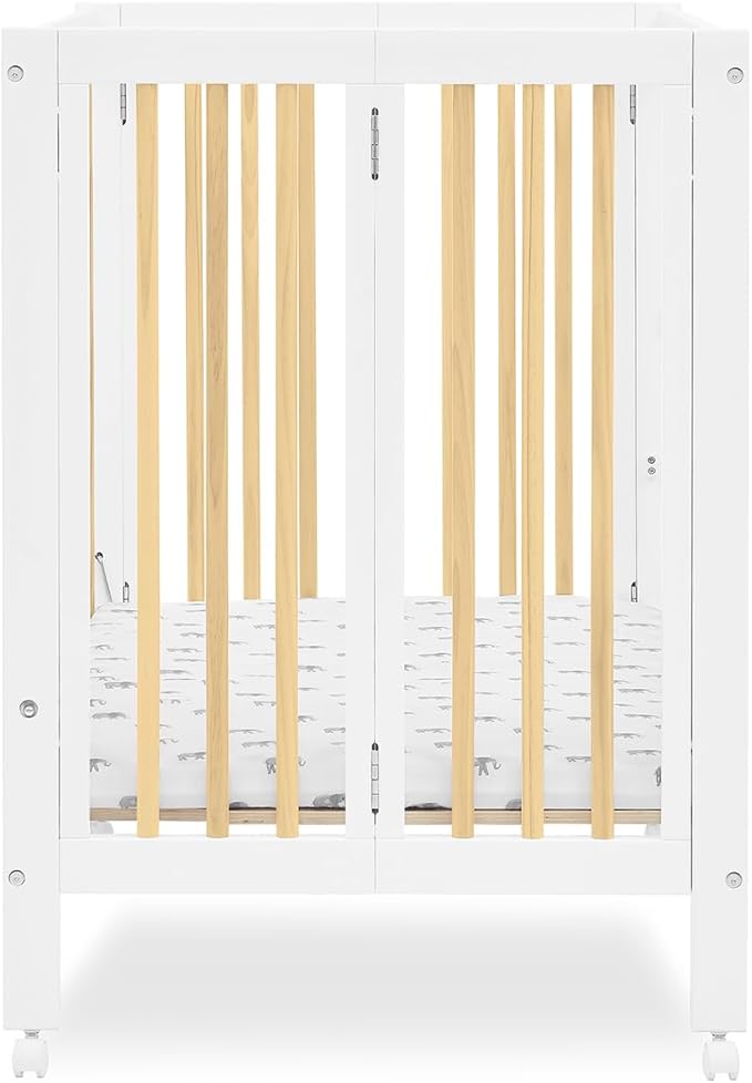 Delta Children Mia Portable Folding Mini Crib with 1.5-Inch Mattress - Greenguard Gold Certified, Bianca White/Natural - LeafyLoom
