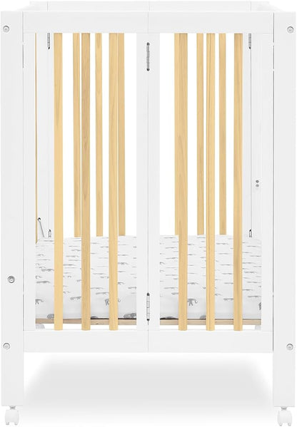 Delta Children Mia Portable Folding Mini Crib with 1.5-Inch Mattress - Greenguard Gold Certified, Bianca White/Natural - LeafyLoom