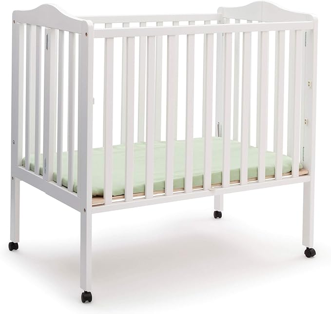 Delta Children Folding Portable Mini Baby Crib with 1.5-inch Mattress - Greenguard Gold Certified, White & Dream On Me Holly 3” Fiber Portable, Greenguard Gold Certified, White - LeafyLoom