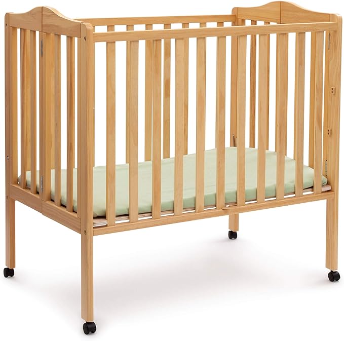 Delta Children Folding Portable Mini Baby Crib with 1.5-inch Mattress - Greenguard Gold Certified, Natural - LeafyLoom