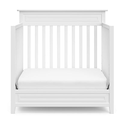 Storkcraft Petal 4-in-1 Convertible Mini Crib (White) – GREENGUARD Gold Certified, Converts to Daybed and Twin-Size Bed, Includes Bonus 2.75-inch Mini Crib Mattress, Mini Crib with Mattress Included - LeafyLoom