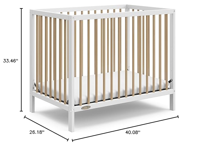 Graco Teddi 4-in-1 Convertible Mini Crib with Bonus Water-Resistant Mattress (White with Driftwood) – GREENGUARD Gold Certified, 2.75-Inch Mattress Included, Convenient Size, Easy 30-Minute Assembly - LeafyLoom