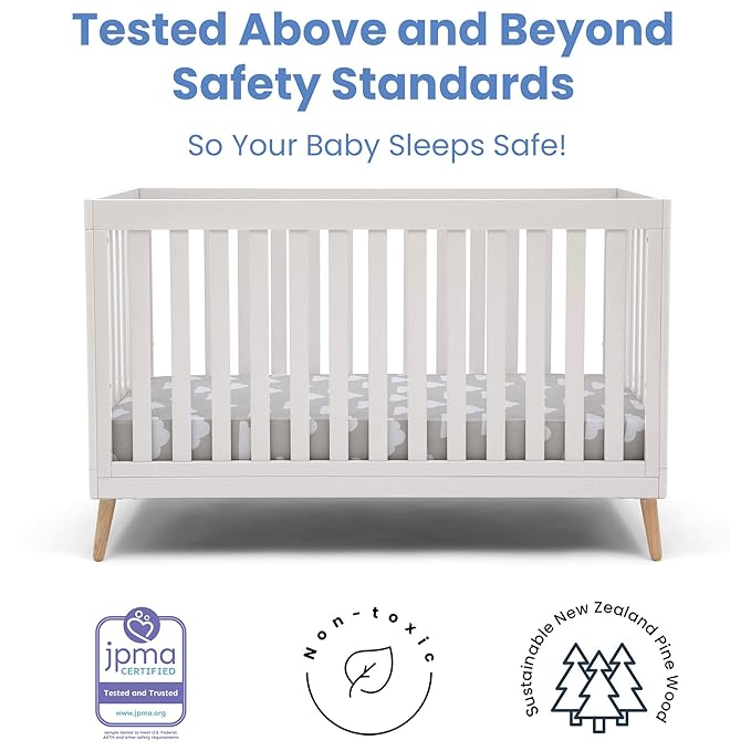 Delta Children Essex 4-in-1 Convertible Baby Crib, Bianca White with Natural Legs + Delta Children Twinkle Galaxy Dual Sided Recycled Fiber Core Crib and Toddler Mattress (Bundle) - LeafyLoom