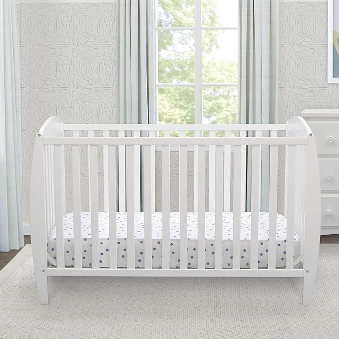 Delta Children Twinkle 4-in-1 Convertible Baby Crib, Sustainable New Zealand Wood, White and Delta Children Twinkle Galaxy Dual Sided Recycled Fiber Core Crib and Toddler Mattress (Bundle) - LeafyLoom