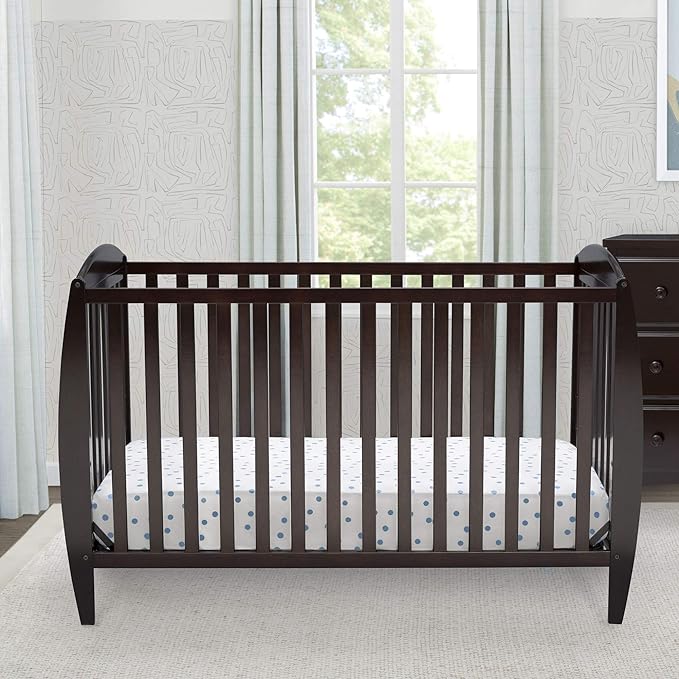 Delta Children Taylor 4-in-1 Convertible Baby Crib, Easy to Assemble, Sustainable New Zealand Wood, JPMA Certified, Dark Chocolate - LeafyLoom