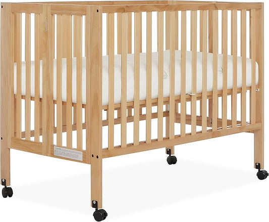 Quinn Full-Size Folding Crib in Natural, Removeable Wheels, Modern Nursey, Adjustable Mattress Support, Portable Crib, Patented Folding System - LeafyLoom