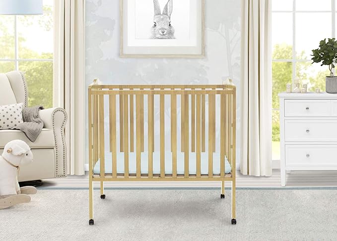 Delta Children Folding Portable Mini Baby Crib with 1.5-inch Mattress - Greenguard Gold Certified, Natural - LeafyLoom